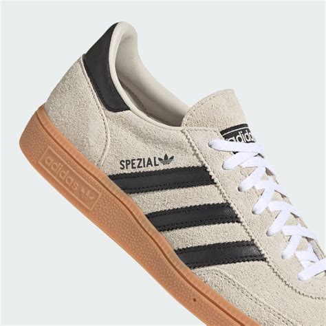 cream and black Adidas spezials